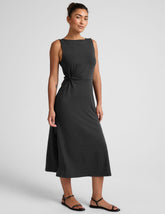 black midi dress with a bateau neck and side twist.